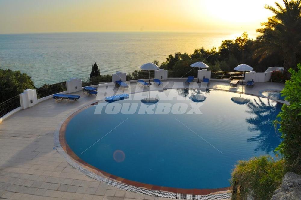 holiday in Studio apartments Maria with pool in Agios Gordios Beach